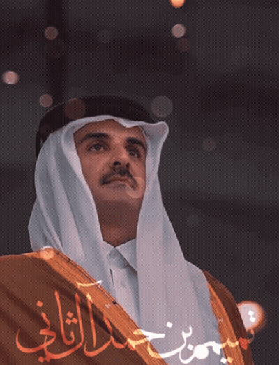 A Man In A Traditional Costume With Arabic Writing On It GIF