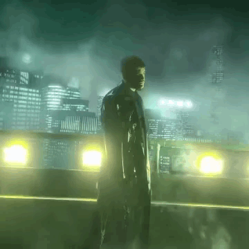 A Man In A Trench Coat Stands In Front Of A City Skyline At Night GIF