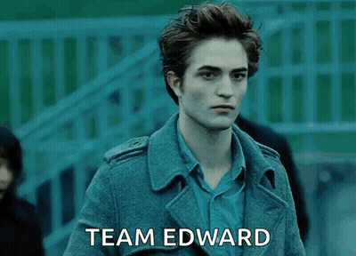 A Man In A Trench Coat With The Words Team Edward Written On The Bottom GIF