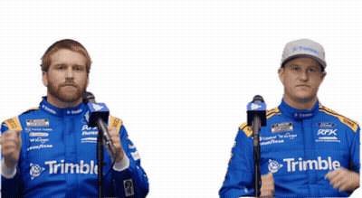 A Man In A Trimble Racing Suit Stands Next To Another Man In A Trimble Racing Suit GIF