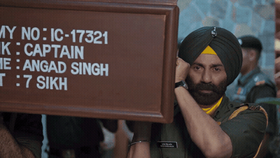 A Man In A Turban Holds Up A Sign That Says My No Ic-17321 GIF