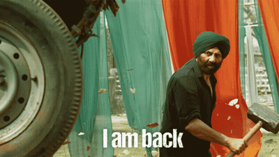 A Man In A Turban Is Holding A Hammer And The Words I Am Back Are On The Bottom GIF