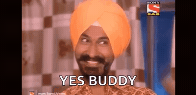 A Man In A Turban Is Smiling And Says Yes Buddy . GIF
