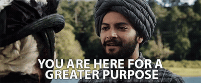 A Man In A Turban Is Talking To A Woman With The Words You Are Here For A Greater Purpose . GIF