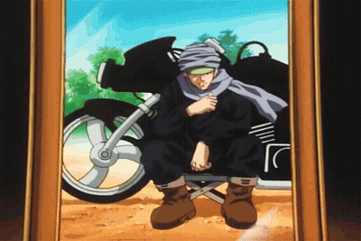 A Man In A Turban Sits In Front Of A Motorcycle GIF
