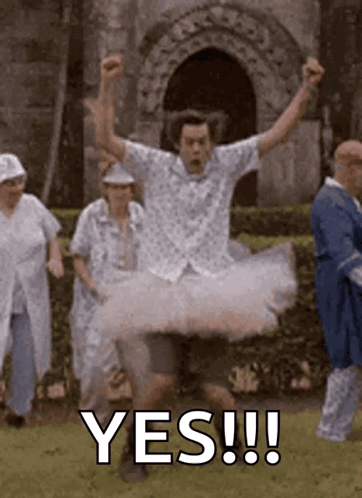 A Man In A Tutu Is Jumping In The Air With The Words Yes !!! Behind Him . GIF