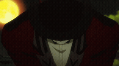 A Man In A Tuxedo And Bow Tie Holds A Yellow Object In His Hand GIF