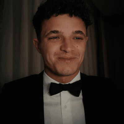 A Man In A Tuxedo And Bow Tie Is Giving A Thumbs Up GIF