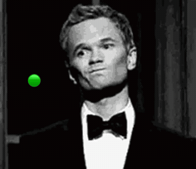 A Man In A Tuxedo And Bow Tie Is Looking At A Green Ball In The Air . GIF