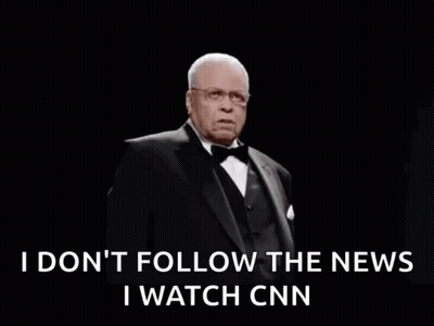 A Man In A Tuxedo And Bow Tie Is Saying I Do N't Follow The News GIF