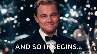 A Man In A Tuxedo And Bow Tie Is Smiling And Saying `` And So It Begins '' . GIF