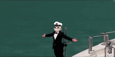 A Man In A Tuxedo And Hat Is Standing On The Side Of A Yacht . GIF