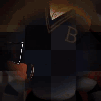 A Man In A Tuxedo Is Holding A Bat With The Letter B On It GIF
