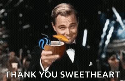 A Man In A Tuxedo Is Holding A Coconut Drink With A Straw And Says `` Thank You Sweetheart '' . GIF