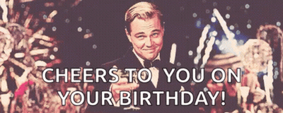 A Man In A Tuxedo Is Holding A Glass Of Champagne And Says Cheers To You On Your Birthday GIF