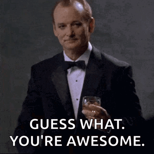 A Man In A Tuxedo Is Holding A Glass Of Whiskey And Saying " Guess What You 'Re Awesome " GIF