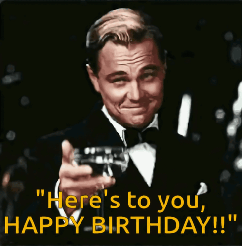 A Man In A Tuxedo Is Holding A Glass Of Wine And Says " Here 'S To You Happy Birthday !! " GIF