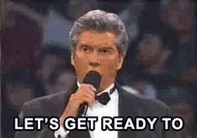 A Man In A Tuxedo Is Holding A Microphone And Saying `` Let 'S Get Ready To '' GIF