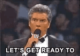 A Man In A Tuxedo Is Holding A Microphone In His Hand And Says `` Let 'S Get Ready To '' . GIF