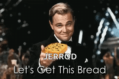A Man In A Tuxedo Is Holding A Piece Of Bread With The Words Let 'S Get This Bread Below Him GIF