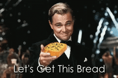 A Man In A Tuxedo Is Holding A Slice Of Bread And Says " Let 'S Get This Bread " GIF
