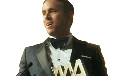 A Man In A Tuxedo Is Holding A Trophy That Says Aaa Sticker