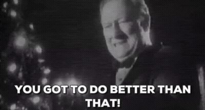 A Man In A Tuxedo Is Smiling In Front Of A Christmas Tree And The Words `` You Got To Do Better Than That '' . GIF