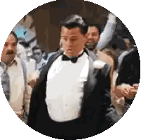 A Man In A Tuxedo Is Standing In A Crowd Of People . Sticker