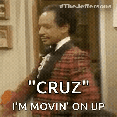 A Man In A Tuxedo Is Standing In A Doorway And Saying `` Cruz '' I 'M Movin ' On Up GIF