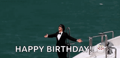 A Man In A Tuxedo Is Standing On A Boat With His Arms Outstretched And The Words `` Happy Birthday ! '' GIF