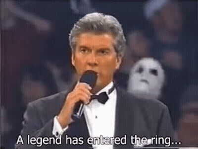 A Man In A Tuxedo Is Talking Into A Microphone And Saying `` A Legend Has Entered The Ring ... '' GIF