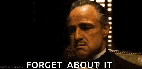 A Man In A Tuxedo Is Talking On A Cell Phone And Says `` Forget About It '' . GIF