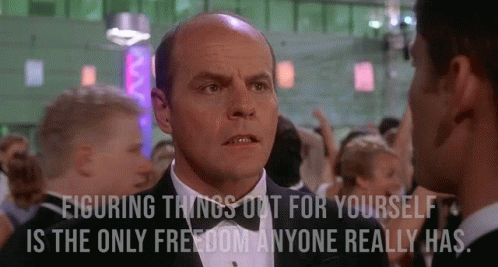 A Man In A Tuxedo Is Talking To Another Man In A Crowd With The Caption Figuring Things Out For Yourself GIF