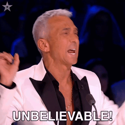 A Man In A Tuxedo Says Unbelievable In Front Of A Crowd GIF