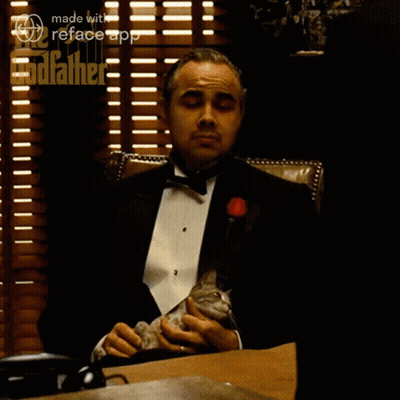 A Man In A Tuxedo Sits At A Desk With A Cat On His Lap And The Words I Understand Above Him GIF