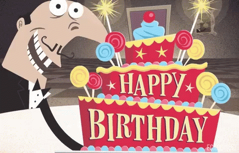 A Man In A Tuxedo Stands In Front Of A Birthday Cake GIF