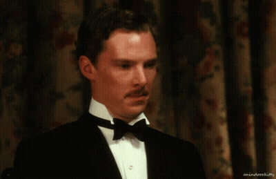 A Man In A Tuxedo With A Bow Tie Has A Watermark That Says Animateorkitty GIF