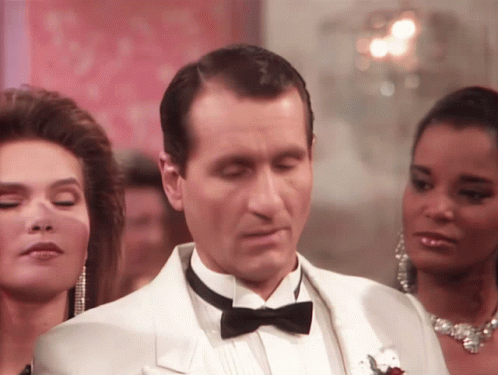 Man In Tuxedo Looking Down GIF