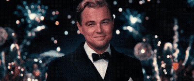 A Man In A Tuxedo With A Bow Tie Smiles GIF