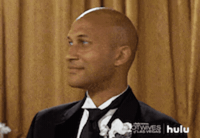 A Man In A Tuxedo With A Hulu Logo On The Bottom GIF
