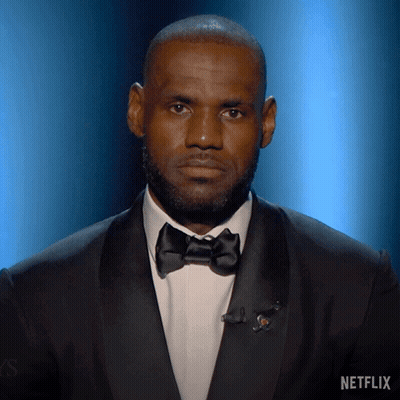 A Man In A Tuxedo With A Netflix Logo On The Bottom GIF