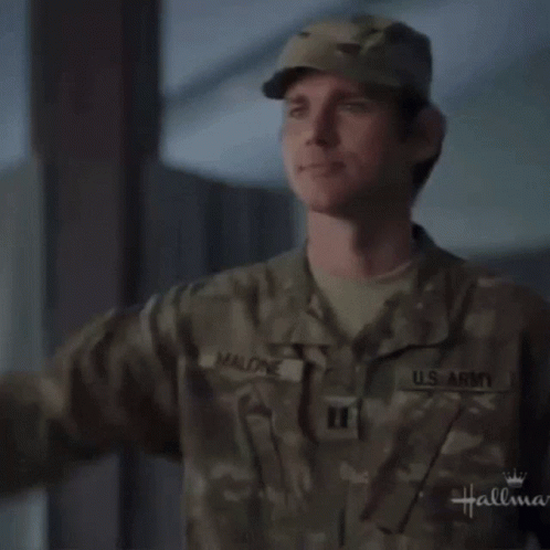 A Man In A U.s. Army Uniform Saluting GIF