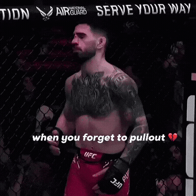 A Man In A Ufc Belt Stands In Front Of A Sign That Says " Serve Your Nation " GIF