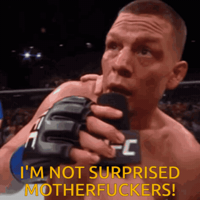 A Man In A Ufc Glove Is Holding A Microphone And Saying I 'M Not Surprised Motherfuckers GIF