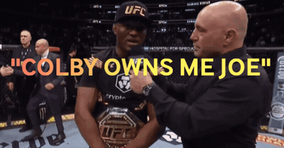 A Man In A Ufc Hat Is Being Pinned By Another Man GIF
