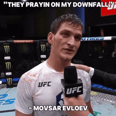 A Man In A Ufc Shirt Is Being Interviewed By A Ufc Reporter GIF