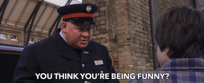 A Man In A Uniform Asks A Boy If He Thinks He 'S Funny GIF