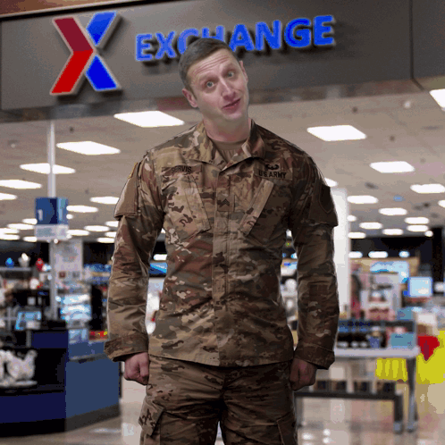 A Man In A Us Army Uniform Stands In Front Of An X Exchange Sign GIF