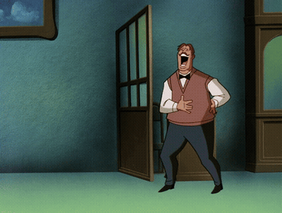 A Man In A Vest And Bow Tie Is Laughing With His Mouth Open GIF