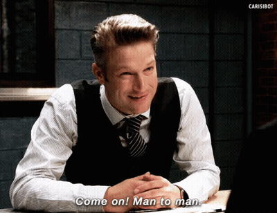 A Man In A Vest And Tie Is Sitting At A Table And Says Come On Man To Man GIF